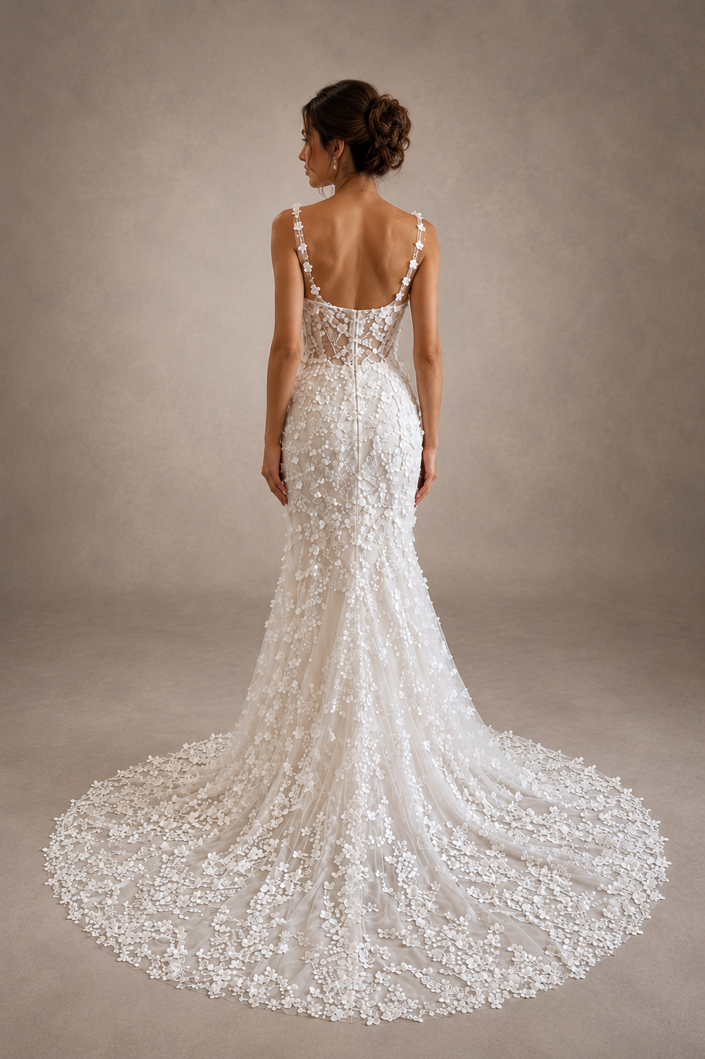 White lace wedding dress with a long train on a neutral background