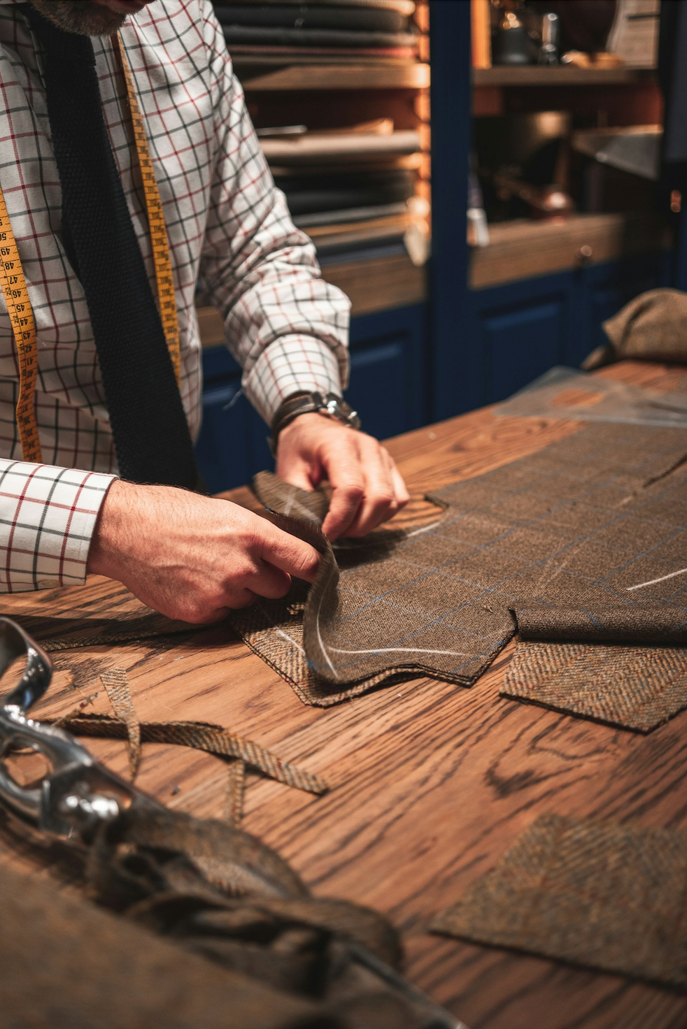 Final fitting for a custom-made suit with adjustments by tailor